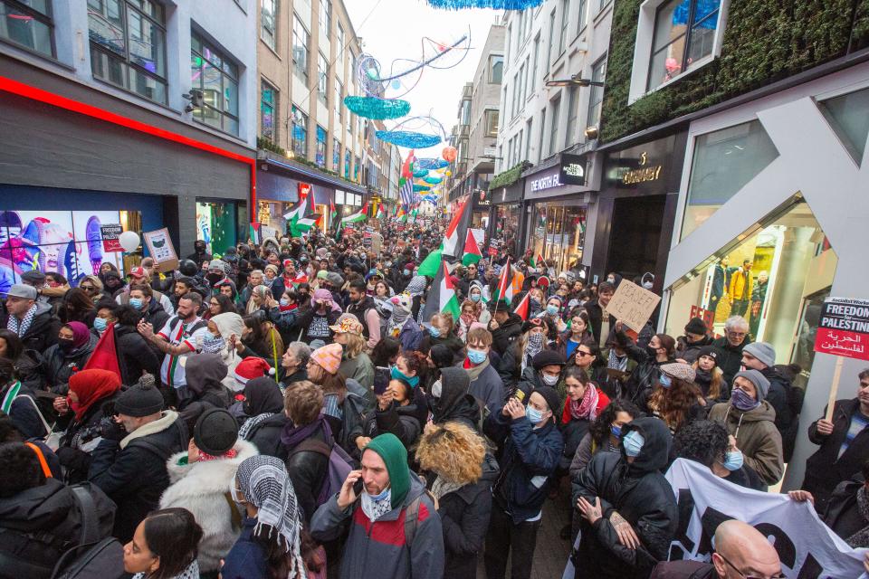 London, England, UK. 23rd Dec, 2023. Hundreds of pro-Palestine activists protest certain fashion brands outside their London flagship stores in West End ahead of Christmas over their relations with Israel. (Credit Image: © Tayfun Salci/ZUMA Press Wire) EDITORIAL USAGE ONLY! Not for Commercial USAGE! Credit: ZUMA Press, Inc./Alamy Live News