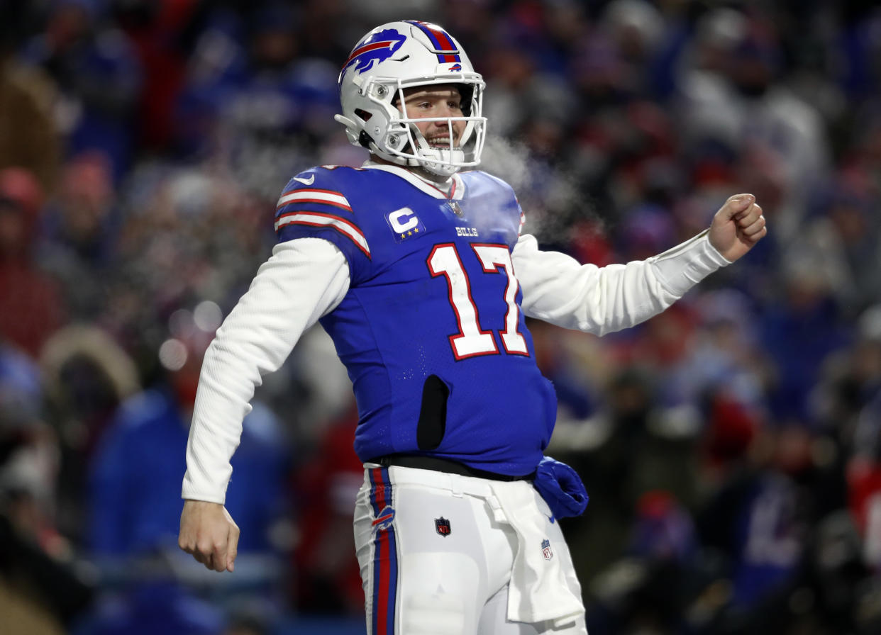 Orchard Park, NY - January 15: Bills quarterback Josh Allen (17) does a little dance as he celebrates a fourth quarter touchdown pass to Gabriel Davis. The Buffalo Bills host the New England Patriots in a AFC wild-card game Saturday night January 15, 2022 at Highmark Stadium in Orchard Park, NY. (Photo by Jim Davis/The Boston Globe via Getty Images)