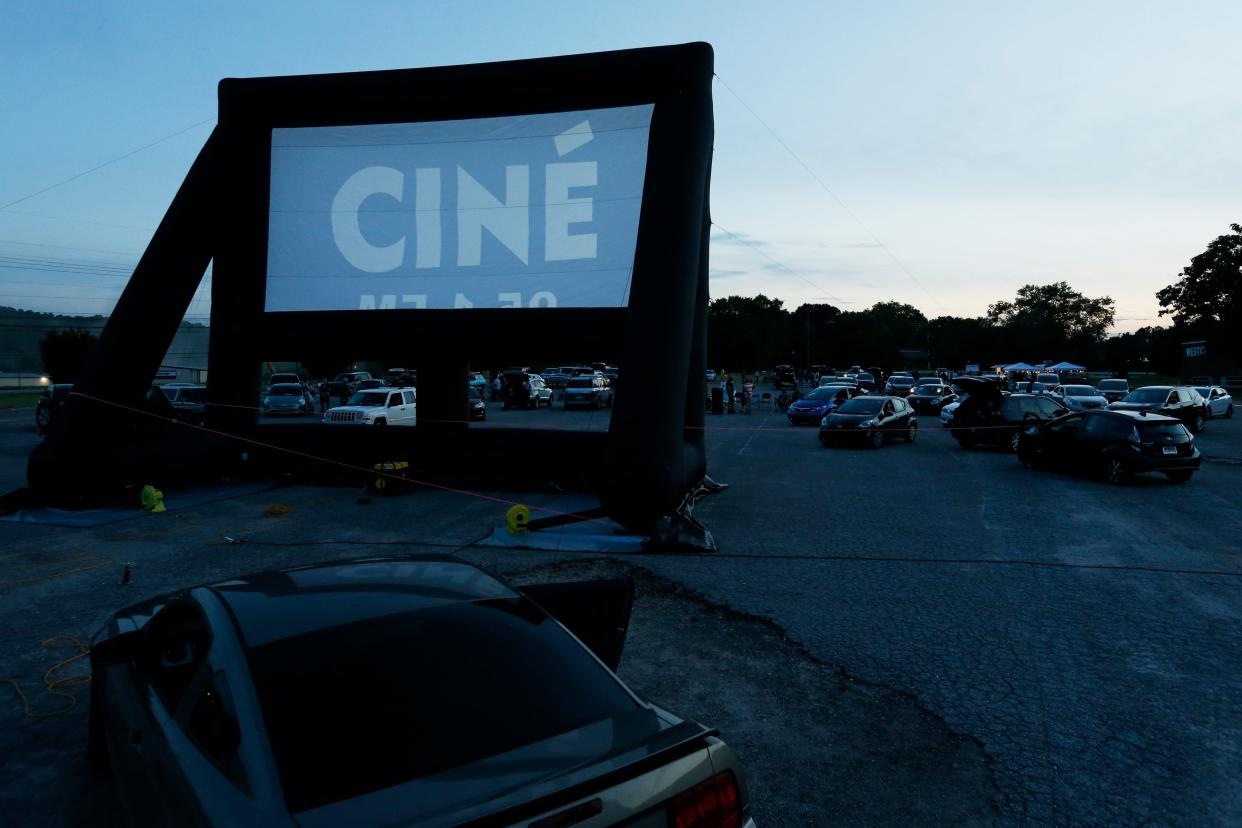 The screen starts to light up as the sun sets during the opening night of Ciné’s drive-in movie theater in Athens, Ga., on Tuesday, June 1, 2021. The theater showed “Mad Max: Fury Road” to start out its summer drive-in movie theater shows with a sold-out parking lot at the General Time/Westclox clock factory on Newton Bridge Road.