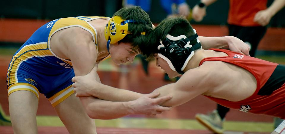 Ryder Mulherin of Jefferson eye to eye with Josh Hubbard of Huron in the 138 pound match as Mulherin won the match 13-3 Tuesday, January 24, 2023.