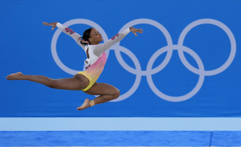 FILE - In this Aug. 2, 2021, file photo, Rebeca Andrade, of Brazil, performs on the floor during the artistic gymnastics women's apparatus final at the 2020 Summer Olympics in Tokyo, Japan. The 50th artistic gymnastics world championships started Monday, Oct. 18, 2021 and will continue through Sunday in Kitakyushu, featuring more than 300 gymnasts representing 59 countries. (AP Photo/Gregory Bull, File)