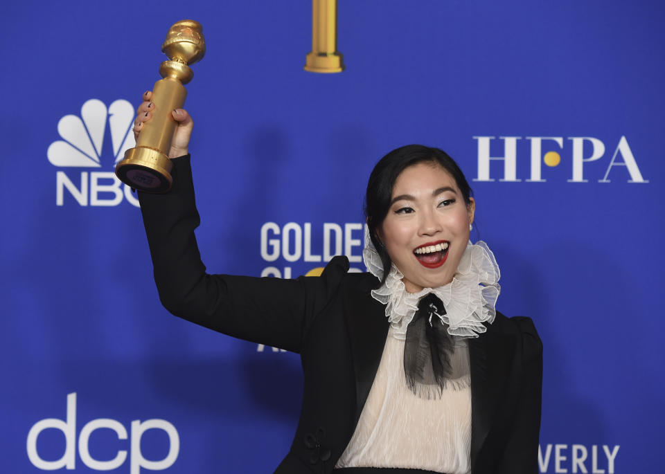 Awkwafina poses in the press room with the award for best performance by an actress in a motion picture, musical or comedy for "The Farewell" at the 77th annual Golden Globe Awards at the Beverly Hilton Hotel on Sunday, Jan. 5, 2020, in Beverly Hills, Calif. (AP Photo/Chris Pizzello)