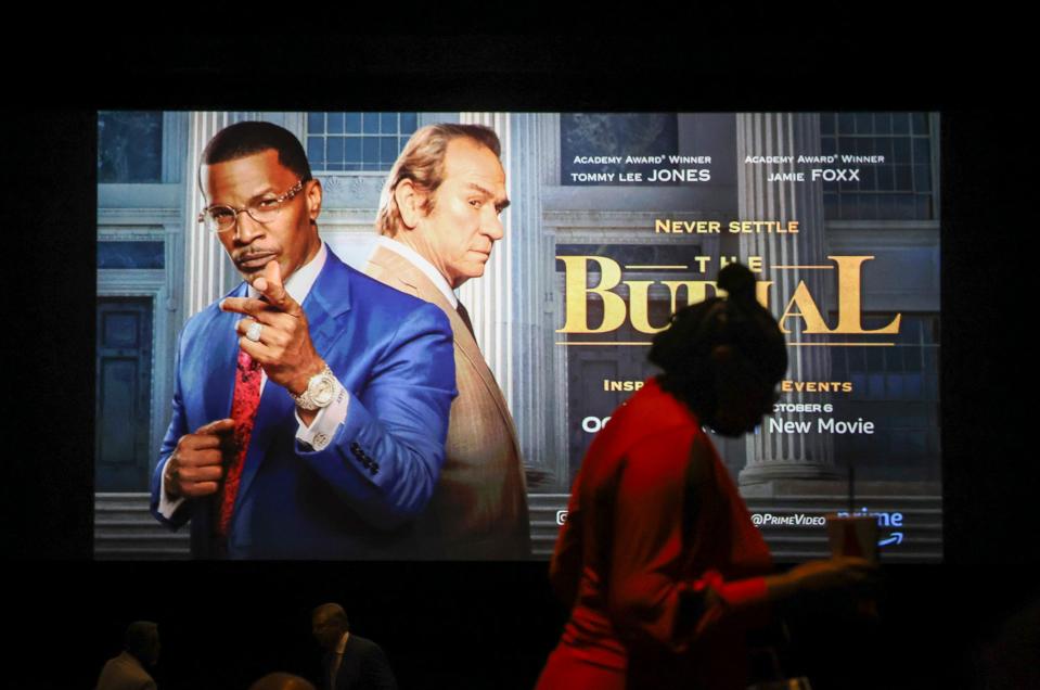 A guest finds a seat before Stuart attorney Willie Gary's private viewing of "The Burial" on Saturday, Sept. 30, 2023, at Cinepolis Luxury Cinemas, 201 U.S. 1, in Jupiter. "The Burial," an Amazon Studios film released to limited theaters Oct. 6 and debuting on Prime Video Oct 13, tells the story of how Gary, then 48, helped Biloxi resident Jeremiah O'Keefe, 72, win a $500 million jury verdict after his funeral business was targeted by a Canadian funeral home corporation that was expanding into the United States.