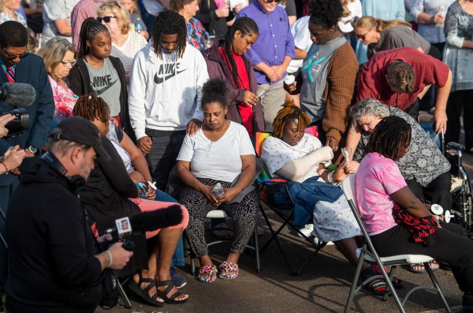 Shooting victim Taniya Cox prays with her family during a prayer vigil at First Baptist Church in Dadeville, Alabama, on Sunday, April 16, 2023.