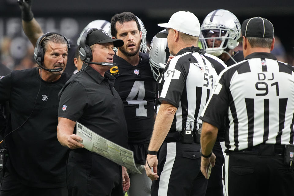 Las Vegas Raiders head coach Jon Gruden speaks with officials during the second half of an NFL football game against the Miami Dolphins, Sunday, Sept. 26, 2021, in Las Vegas. (AP Photo/Rick Scuteri)