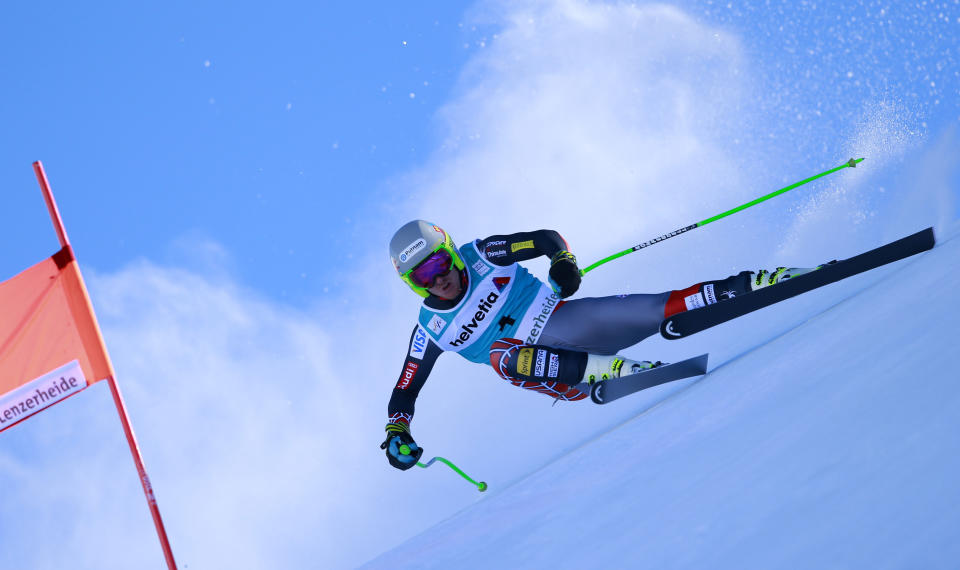 Ted Ligety of the United States, speeds on his way to take second place in a men's alpine skiing downhill at the World Cup finals in Lenzerheide, Switzerland, Wednesday, March 12, 2013. (AP Photo/Shinichiro Tanaka)