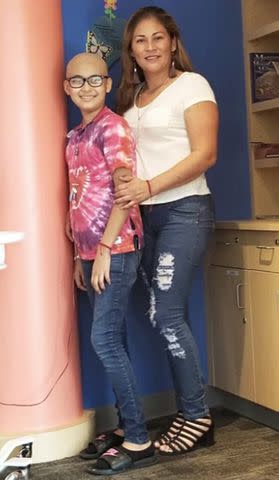 <p>Courtesy of Texas Childrens Hospital</p> Britney Moyeda and her mom in the Texas Children's Cancer and Hematology Center in 2018