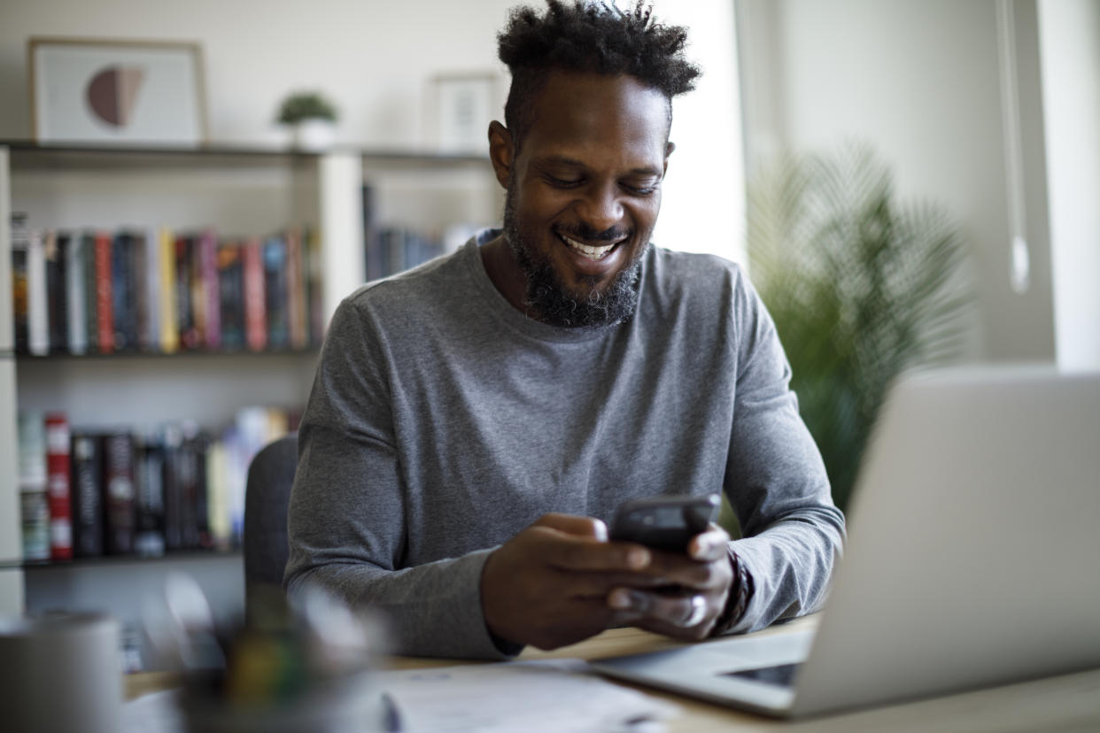 Smiling man working at home