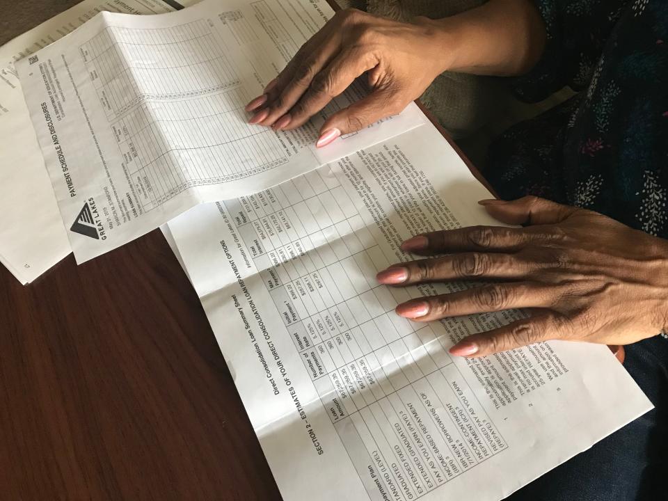 Sharon Stanford, 68, of Southfield reviews the terms of four student loans that she took out for her daughter who graduated from Howard University in 2006. She currently owes more than $68,000 as interest has built over time.