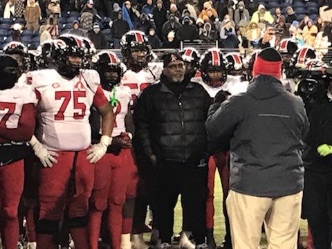 Glenville football players celebrate their state title around head coach Ted Ginn St. (center) after their win over Cincinnati Wyoming on Saturday, Dec. 3, 2022, at Tom Benson Hall of Fame Stadium.