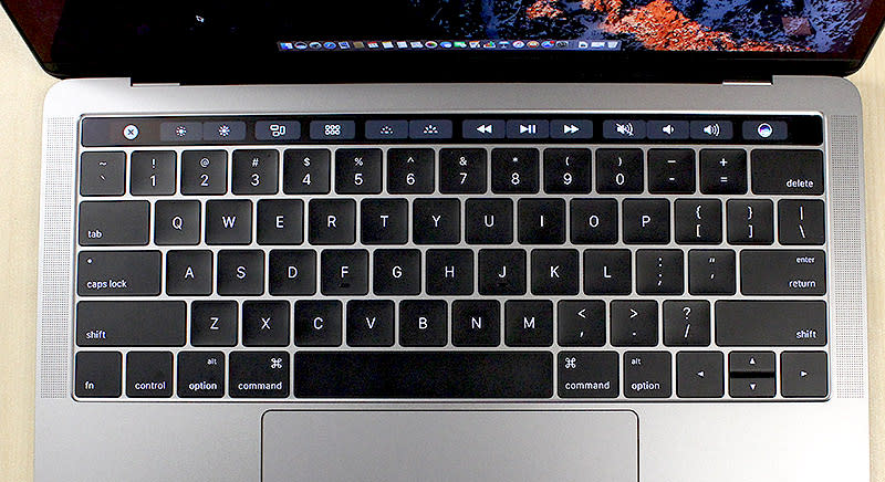 The Touch Bar sits above the keyboard and replaces the traditional function and media shortcut keys.