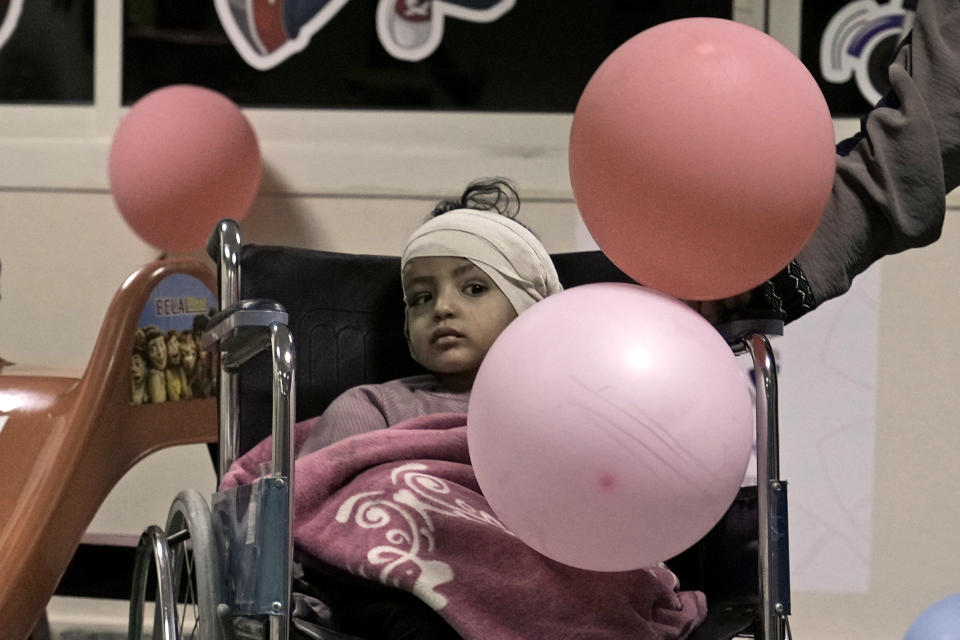 Nour, a Palestinian girl who was injured during the war in Gaza, arrives at a kids play area at Al Arish hospital, Egypt, Monday, Nov. 27, 2023. (AP Photo/Amr Nabil)