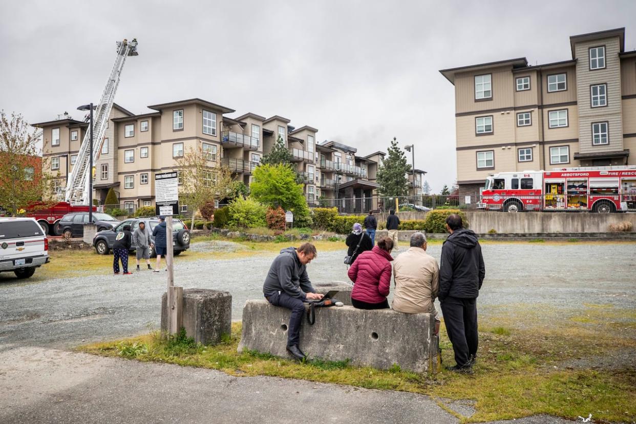 A massive Abbotsford condo fire on May 3, 2022, displaced more than 160 people from their homes. Two years later, more than 20 former residents are suing three former neighbours, alleging negligence with smoking and propane tanks and BBQs they claim started or accelerated the fire. (Ben Nelms/CBC - image credit)
