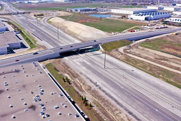 The new eight-lane extension of Highway 427, which appears complete to the naked eye, is subject of a multi-million-dollar legal dispute.