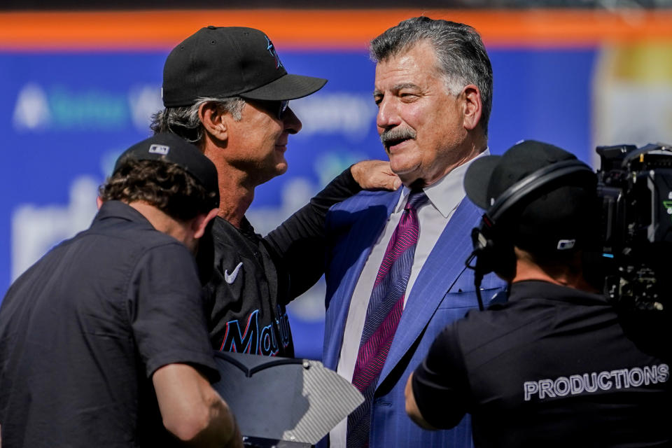 New York Mets announcer and former player Keith Hernandez, right, greets Miami Marlins manager Don Mattingly, left, after a pre-game ceremony to retire his player number before a baseball game between the Mets and Marlins, Saturday, July 9, 2022, in New York. (AP Photo/John Minchillo)