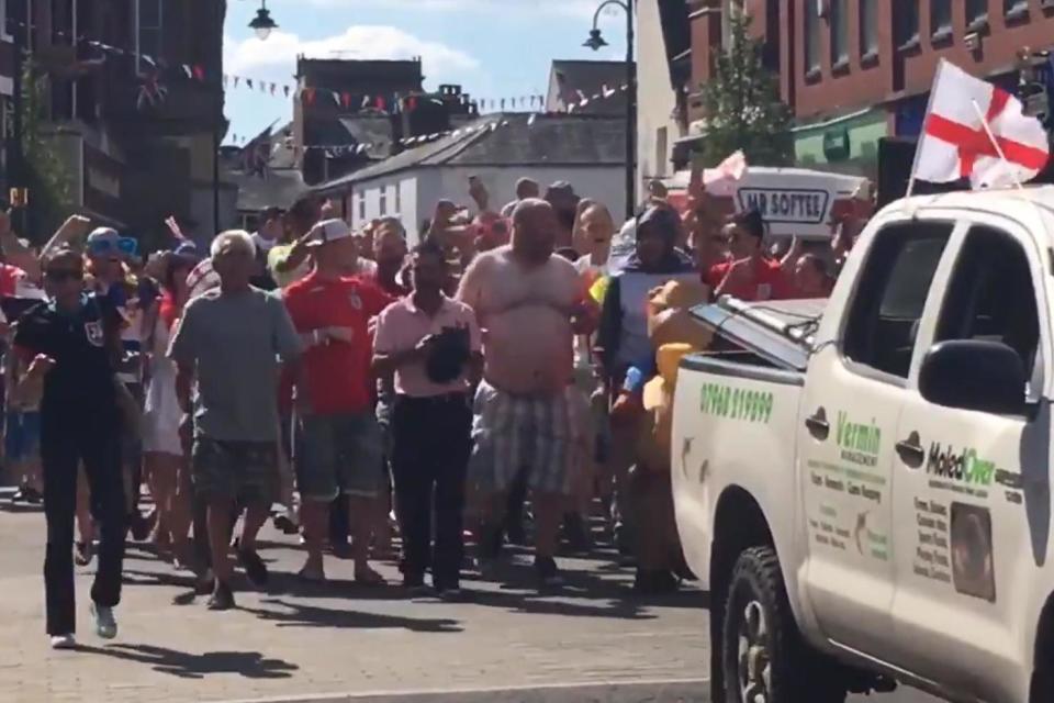 Joyous England fans recreate Fat Les' Vindaloo video from World Cup 1998 as they march behind truck in Leek