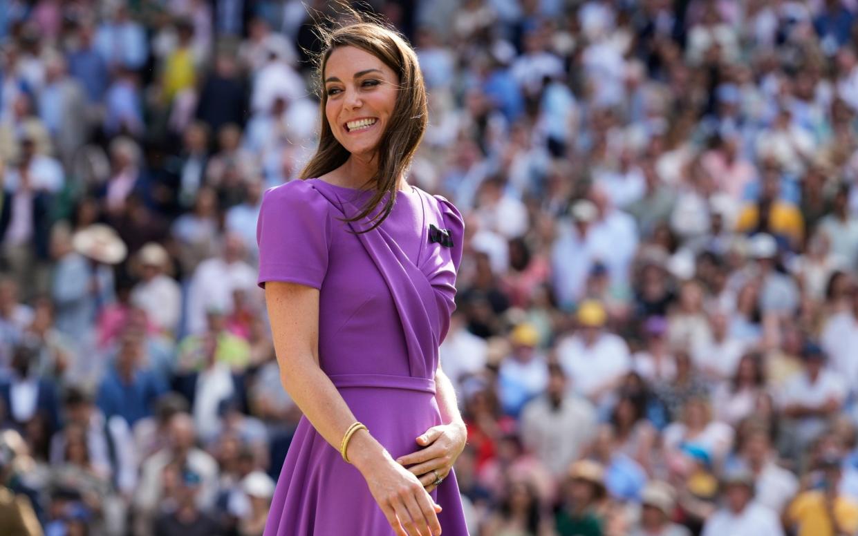 Kate, Princess of Wales, smiles as she waits to present the trophy to Carlos Alcaraz of Spain at the men's singles final at the Wimbledon tennis championships in London, July 14, 2024.