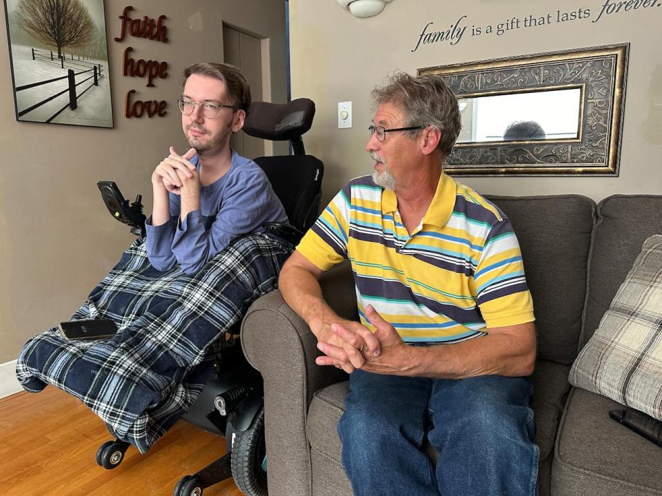 Luke Marchant (left) and his father Winton Marchant (right) in their home in Windsor's Riverside area.