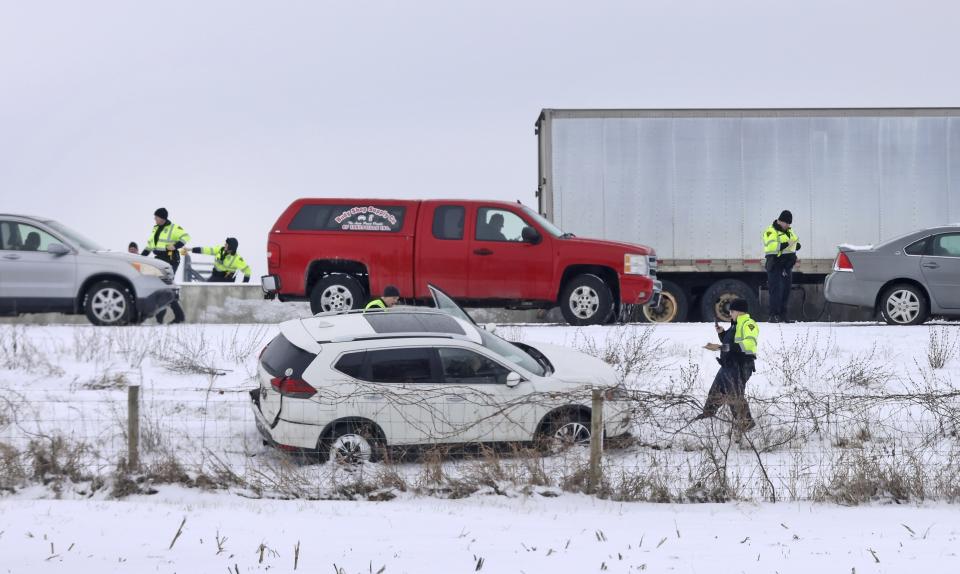 Emergency crews respond to a multi-vehicle accident in both the north and south lanes of Interstate 39/90 on Friday, Jan. 27, 2023, in Turtle, Wis. Authorities say snowy conditions led to the massive traffic pile-up in southern Wisconsin on Friday that left Interstate 39/90 blocked for hours. (Anthony Wahl/The Janesville Gazette via AP)