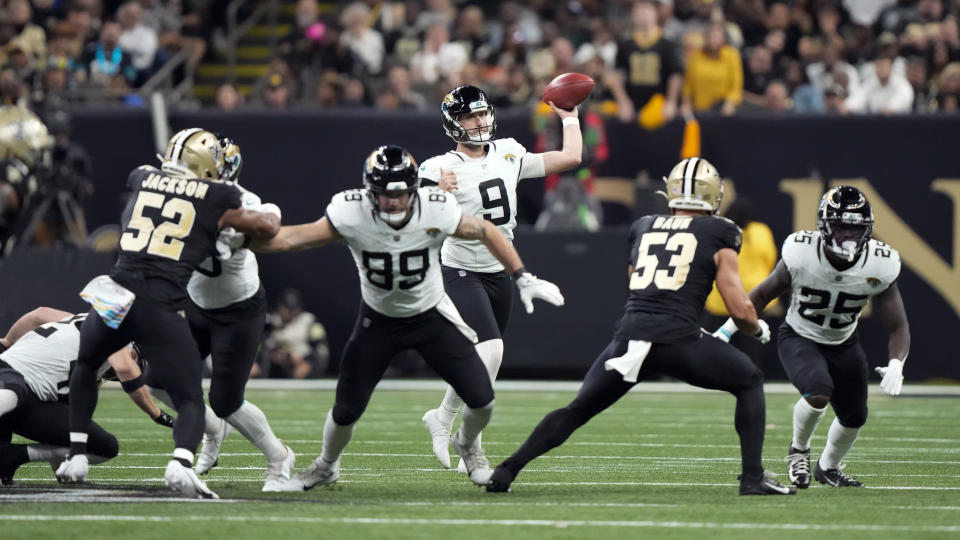 Jacksonville Jaguars punter Logan Cooke (9) throws a pass against the New Orleans Saints on a fake punt play in the first half of an NFL football game in New Orleans, Thursday, Oct. 19, 2023. (AP Photo/Gerald Herbert)