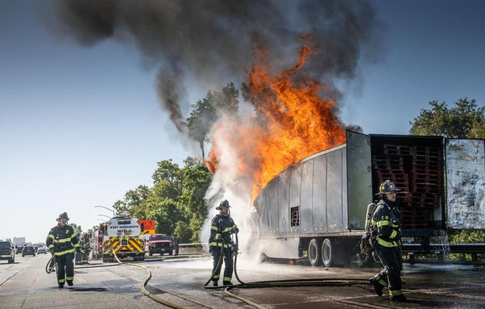 Sacramento and West Sacramento firefighters respond to a big rig fire on Highway 50 just east of Interstate 5 on Friday.