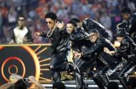 Bruno Mars (L) performs during half-time at the NFL's Super Bowl 50 football game between the Carolina Panthers and the Denver Broncos in Santa Clara, California February 7, 2016. REUTERS/Stephen Lam