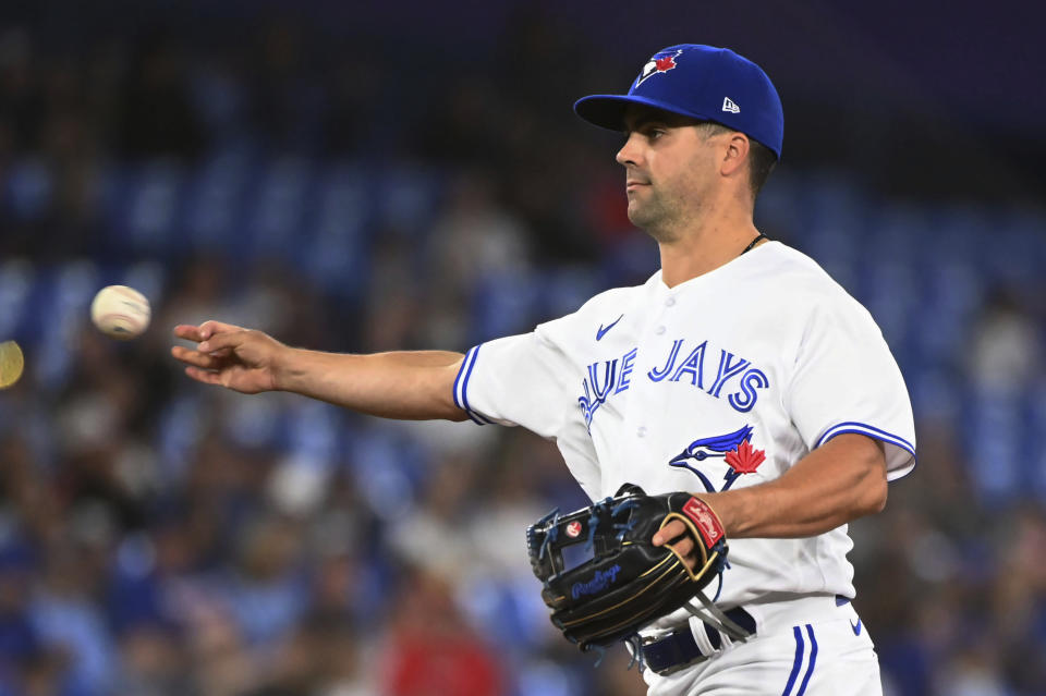 Toronto Blue Jays relief pitcher Whitt Merrifield throws to a Los Angeles Angels batter during ninth-inning baseball game action in Toronto, Friday, Aug. 26, 2022. (Jon Blacker/The Canadian Press via AP)