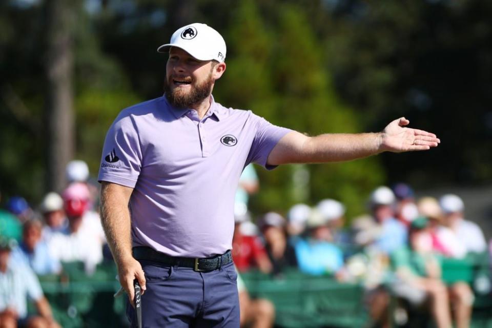 Tyrrell Hatton reacts after missing a putt on the 18th green.