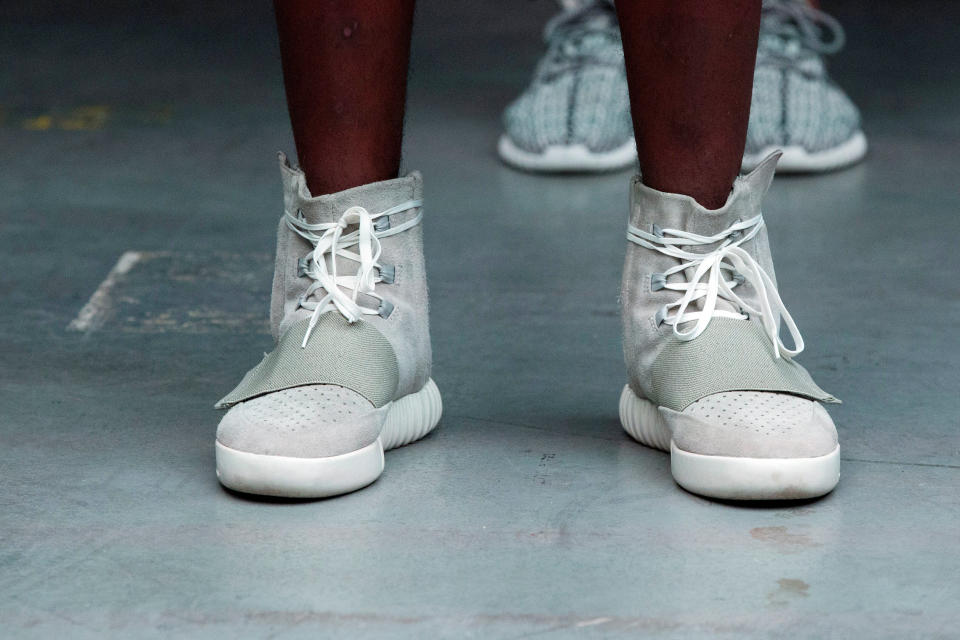 A model wears a pair of Adidas Yeezy 750 Boost shoes designed by Kanye West as part of his Fall/Winter 2015 partnership line with Adidas at New York Fashion Week, U.S. February 12, 2015. Picture taken February 12, 2015. REUTERS/Lucas Jackson/File photo