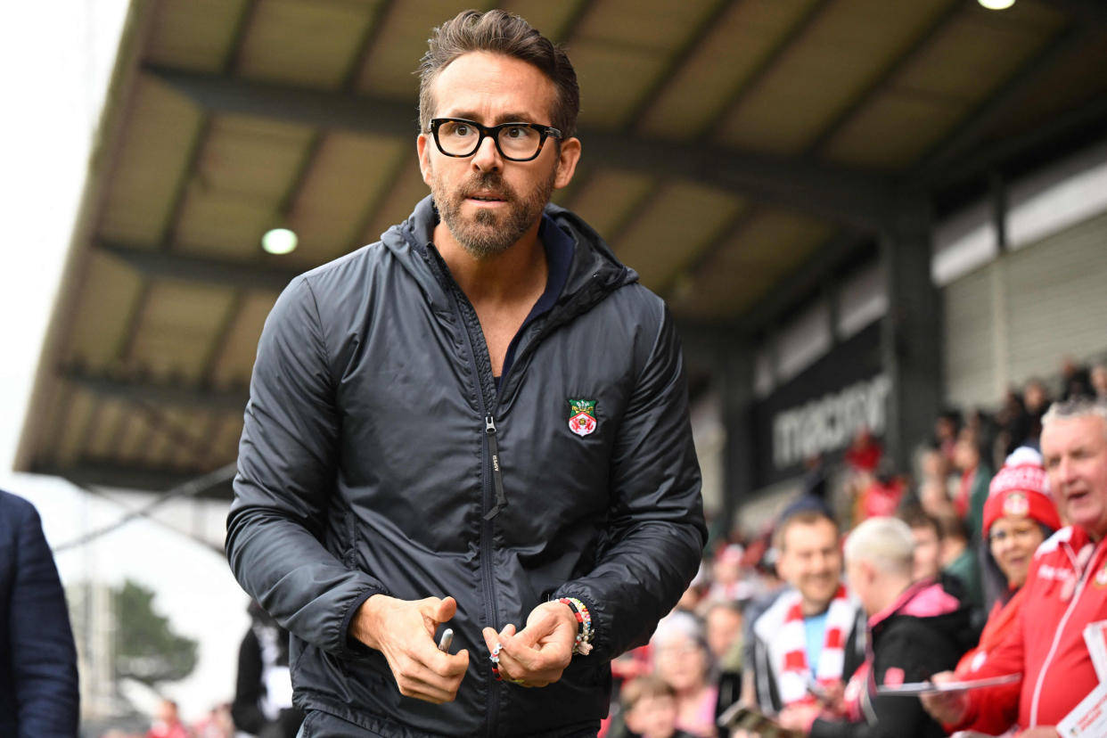 Ryan Reynolds walks pitch-side ahead of the English National League football match in Wrexham, Wales (Oli Scarff / AFP via Getty Images)