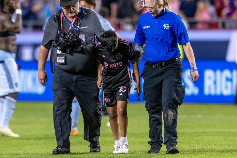 A young Inter Miami fan attempts to run on the field in the second half during an MLS game against Sporting Kansas City at GEHA Field at Arrowhead Stadium on Saturday, April 13, 2024, in Kansas City.