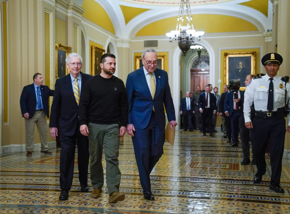 Ukrainian President Volodymyr Zelenskyy, center, with Senate Majority Leader Chuck Schumer (D-NY), right, and Minority Leader Mitch McConnell (R-KY), left, walking to meet with senators on Dec. 12, 2023 in Washington, D.C.