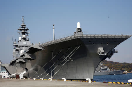 FILE PHOTO: Japan Maritime Self Defense Force's helicopter carrier Izumo is seen at JMSDF Yokosuka base in Yokosuka, south of Tokyo, Japan, December 6, 2016. REUTERS/Kim Kyung-Hoon/File Photo