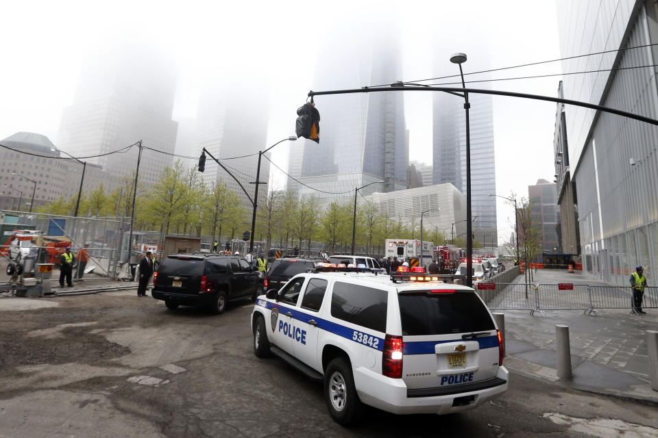 A law enforcement motorcade arrives for the ceremonial transfer of unidentified remains of those killed at the World Trade Center from the Office of the Chief Medical Examiner to the World Trade Center site, Saturday, May 10, 2014, in New York. The remains will be transferred to an underground repository in the same building as the National September 11 Memorial Museum. (AP Photo/Jason DeCrow)