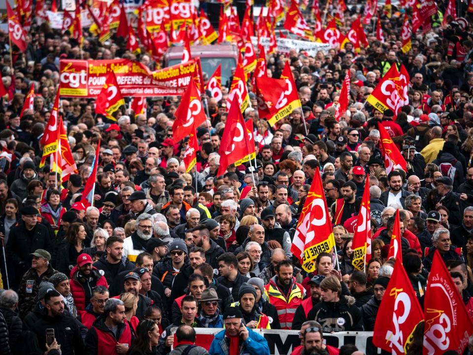 Public and private workers demonstrate and shout slogans during a mass strike against pension reforms on December 05, 2019 in Marseille, France.