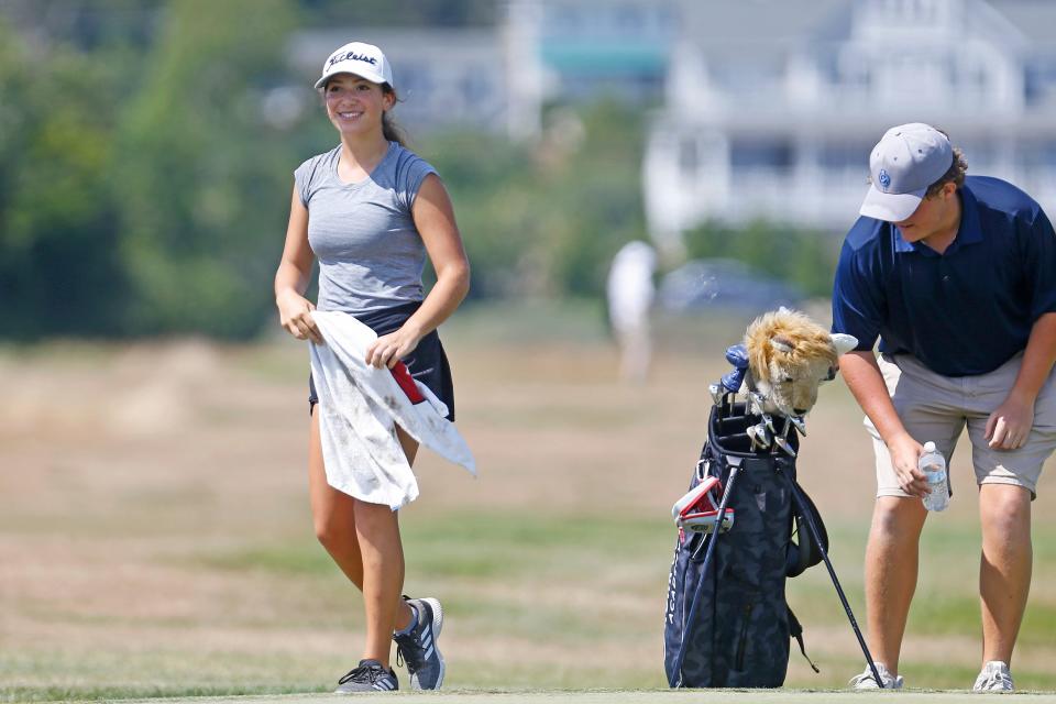 Olivia Williams walks off with a smile after making an eagle on the 10th hole at Winnipaug Country Club during her win over Kylie Eaton on Friday afternoon in the RIGA Junior Amateur Girls Championship final.