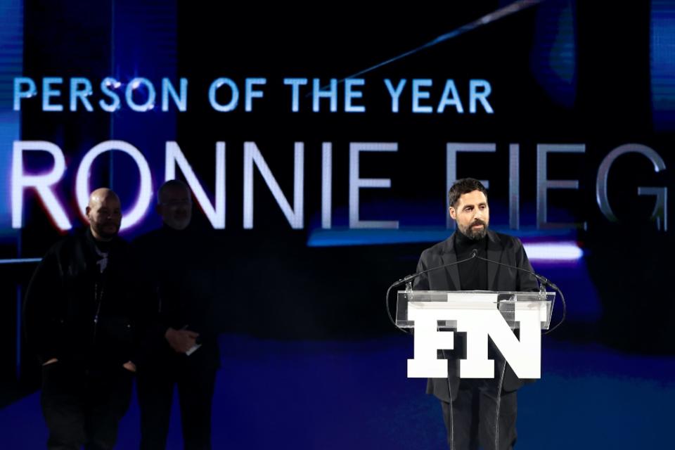 Ronnie Fieg speaks onstage at the 35th annual Footwear News Achievement Awards. - Credit: Getty Images for Footwear News