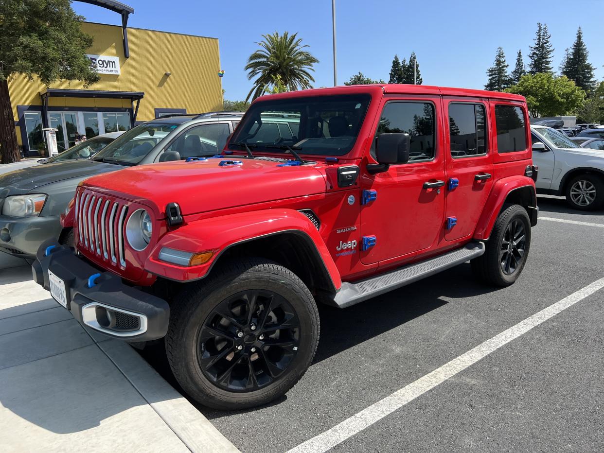 Red Jeep Wrangler 4xe Sahara electric vehicle parked in a lot at Shadelands Business Park, Walnut Creek, California, May 24, 2023. (Photo by Smith Collection/Gado/Getty Images)