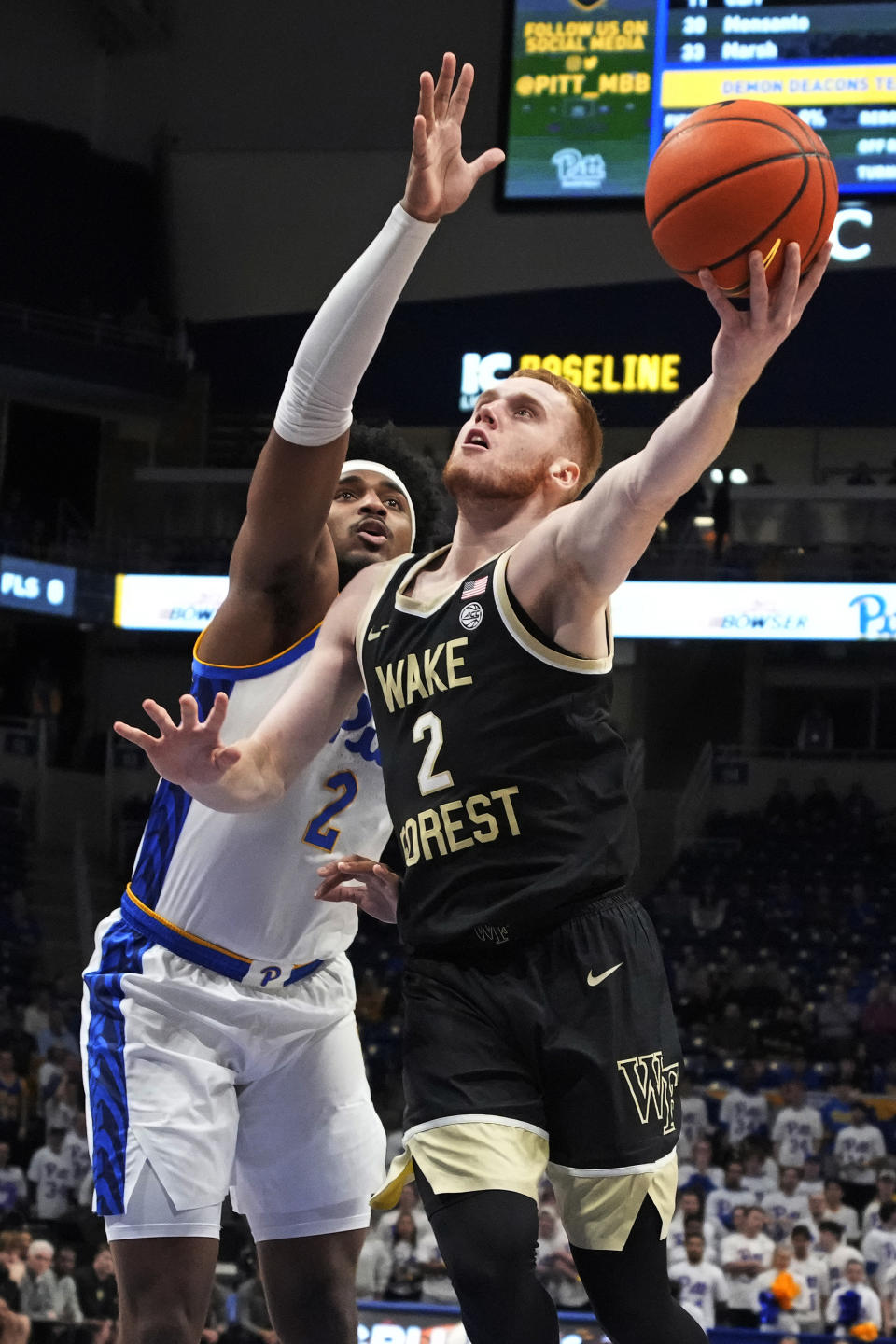 Wake Forest guard Cameron Hildreth (2) puts up a shot with Pittsburgh forward Blake Hinson (2) defending during the first half of an NCAA college basketball game in Pittsburgh, Wednesday, Jan. 25, 2023. (AP Photo/Gene J. Puskar)