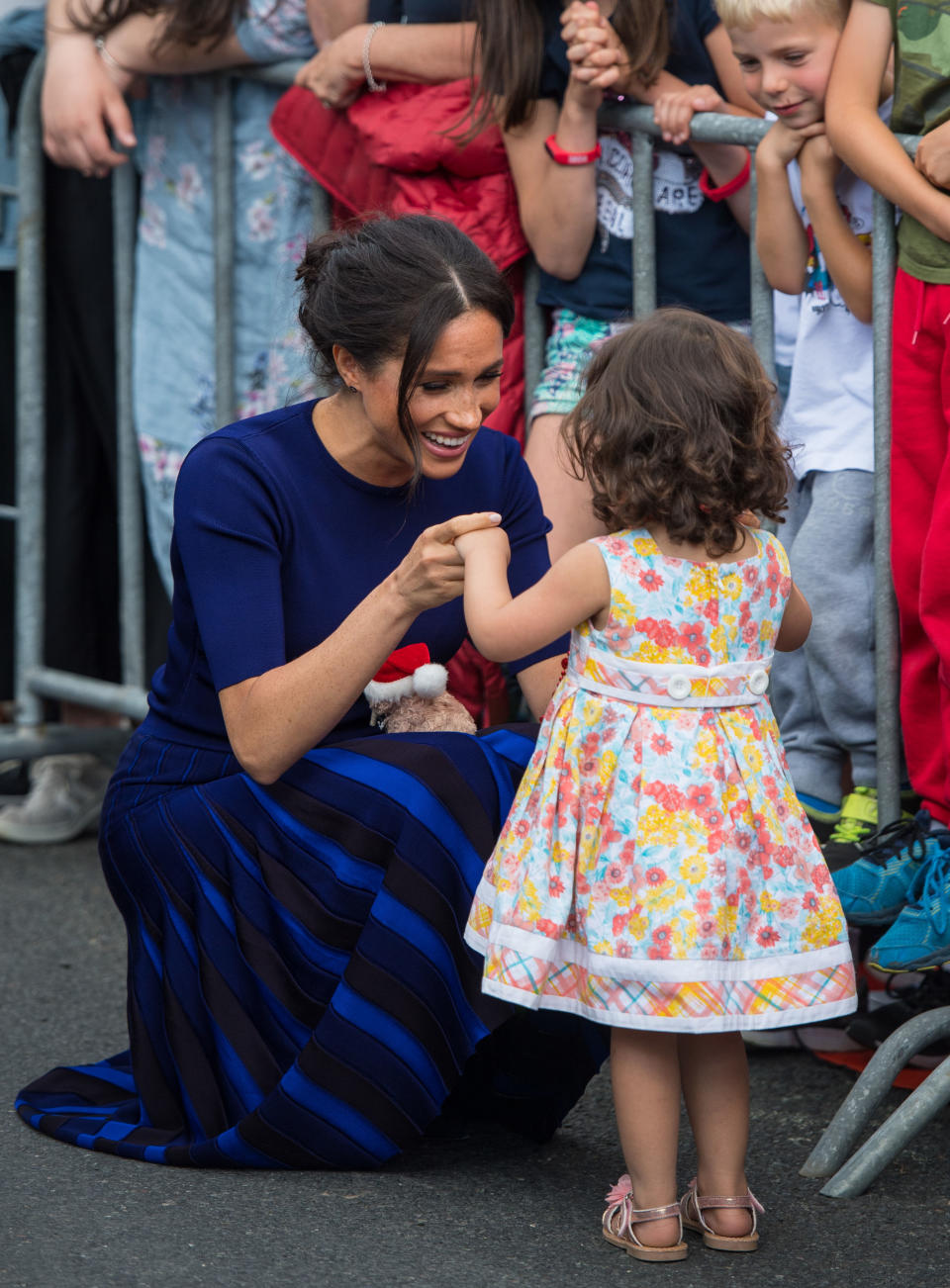 Meghan Markle and Prince Harry’s affectionate ways with the public while on royal tour have reportedly caused a headache for Buckingham Palace officials.