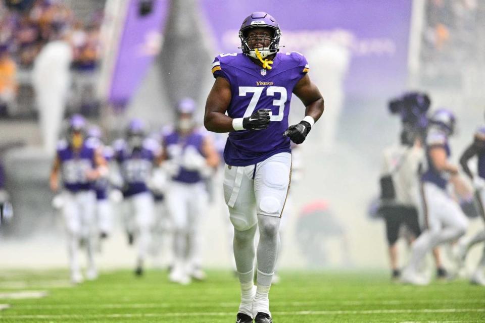 Defensive tackle Junior Aho, then with the Minnesota Vikings, enters the field before the game against the Arizona Cardinals at U.S. Bank Stadium in August 2023.