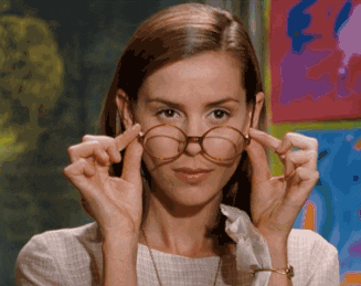 Miss Honey from "Matilda" slowly removes her glasses.