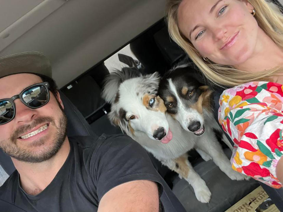 Georgia Crook and her partner Ashley Bowden with their two dogs Mushu (left) and Tilly (right).