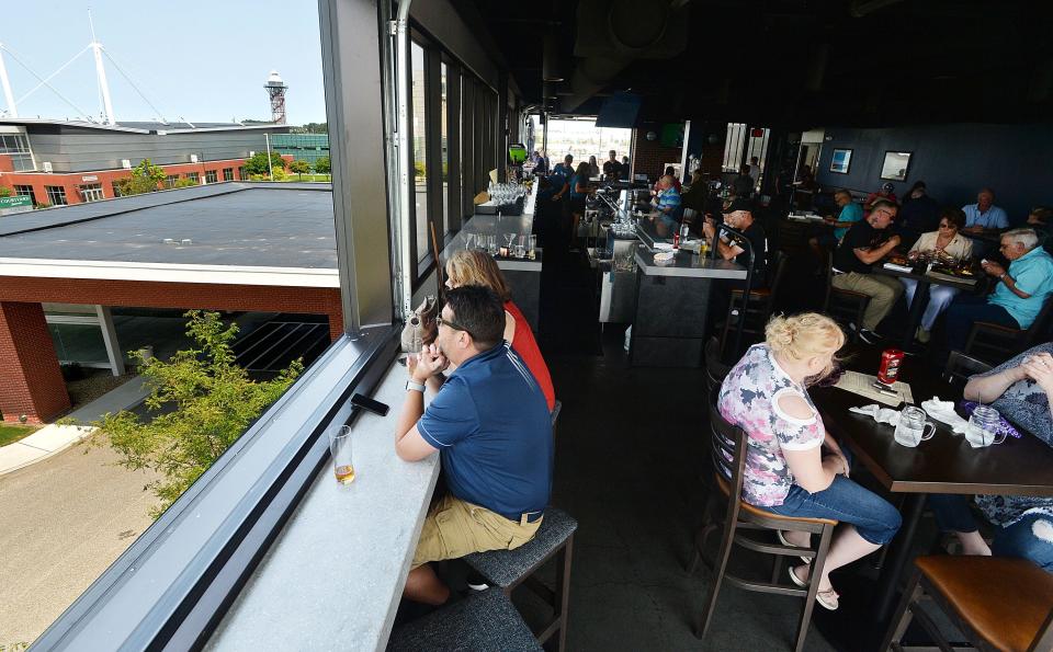 Visitors to Pier 6 Rooftop Bar & Restaurant have views of the Bayfront Convention Center and Bicentennial Tower, background left. In addition to indoor seating, there are outdoor areas on either side, with views of Presque Isle Bay.