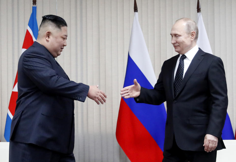 Russian President Vladimir Putin, right, and North Korea's leader Kim Jong Un shake hands during their meeting in Vladivostok, Russia, Thursday, April 25, 2019. Putin sat down for talks Thursday with North Korean leader Kim, saying the summit should help plan joint efforts to resolve a standoff over Pyongyang's nuclear program.(Sergei Ilnitsky/Pool Photo via AP)