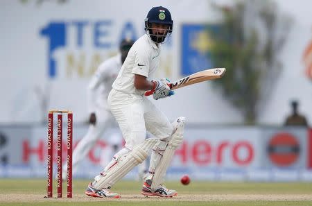 Cricket - Sri Lanka v India - First Test Match - Galle, Sri Lanka - July 26, 2017 - India's cricketer Cheteshwar Pujara plays a shot. REUTERS/Dinuka Liyanawatte