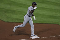 Chicago White Sox's Tim Anderson reacts while running the bases after hitting a solo home run in the fifth inning during a baseball game against the Cincinnati Reds in Cincinnati, Saturday, Sept. 19, 2020. (AP Photo/Aaron Doster)