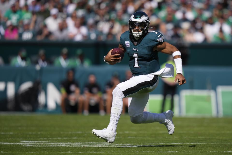 Philadelphia Eagles quarterback Jalen Hurts (1) runs with the ball during the first half of an NFL football game against the Washington Commanders on Sunday, Oct. 1, 2023, in Philadelphia. (AP Photo/Matt Slocum)