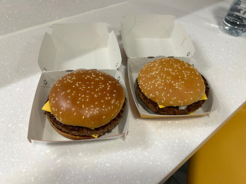 An old and a new Quarter Pounder with Cheese side by side