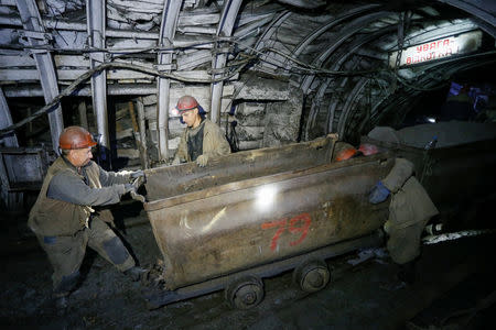 Miners push a cart inside the Novovolynska-9 coal mine in Novovolynsk, Ukraine August 2, 2018. Picture taken August 2, 2018. REUTERS/Valentyn Ogirenko